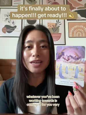 A woman with long dark hair smiles at the camera, holding a tarot card. The background features framed art. Text overlays include a hook and a subtitle.