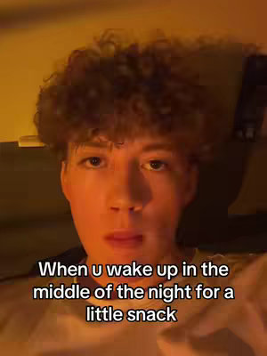 A young man with curly hair looking at the camera. Text overlayed on the bottom describing the video topic.