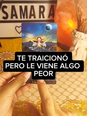 The image shows a person holding a tarot card in their hands with the overlay text. Behind the person, you can see a lit salt lamp, a bust of a face, and a sign reading "SAMARA".
