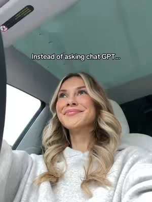A woman is seated inside a car, looking up and to the right with a slight smile, as if pondering something. The text overlay reads 'Instead of asking chat GPT...'