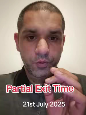 A man with short, dark hair and a light complexion is the focus of a close-up shot. He has stubble and a serious expression, looking directly at the camera with slightly pursed lips. Overlaid in the image are large, bold text stating "Partial Exit Time" in red, followed by "21st July 2025." The background is plain and light-colored.