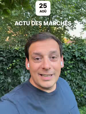 A man with short brown hair is looking directly at the camera and speaking. He is wearing a blue t-shirt, and has white earbuds in. Behind him is a green, leafy background with a date overlay at the top showing "25 AOU".