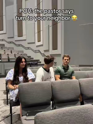 The cover image shows a scene from a church auditorium. Three people are seated in the front row of a pew of gray seats, facing forward: a young woman with long dark hair and a light blue floral top on the left, a person with short brown hair wearing a white t-shirt in the middle, and a man with short brown hair and a green polo shirt on the right. The text overlay says, 'POV: the pastor says turn to your neighbor' with a laughing emoji.