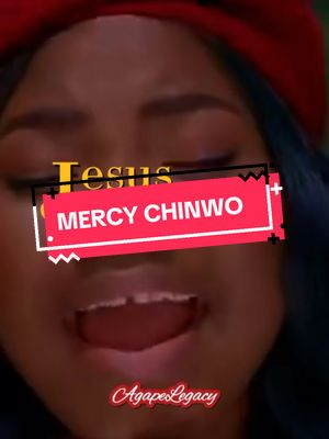 The cover image features a close-up of a woman with a gentle expression. Text overlays read "Jesus" in a stylized font and "MERCY CHINWO" within a red rectangular banner. The background is blurred but appears to be a performance setting. In the bottom corner, the name "AgapeLegacy" is shown in cursive font.