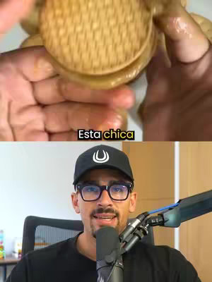 The cover image is split in two sections. The top section displays hands holding a sandwich, possibly in the process of being made or assembled. Below, there is a person in the same frame facing and looking at the camera speaking in front of a microphone.