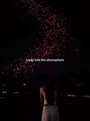 A dark image features a figure standing in front of a scattering of illuminated red points across the night sky. Text overlayed highlights the phase, 'I pray into the atmosphere'.