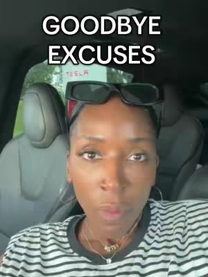 A selfie-style shot taken inside a vehicle. A woman with dark skin is looking at the camera, she is wearing sunglasses on top of her head, and has a determined expression. The text overlay says "GOODBYE EXCUSES". The background is blurred, but suggests a lush green outdoor setting.