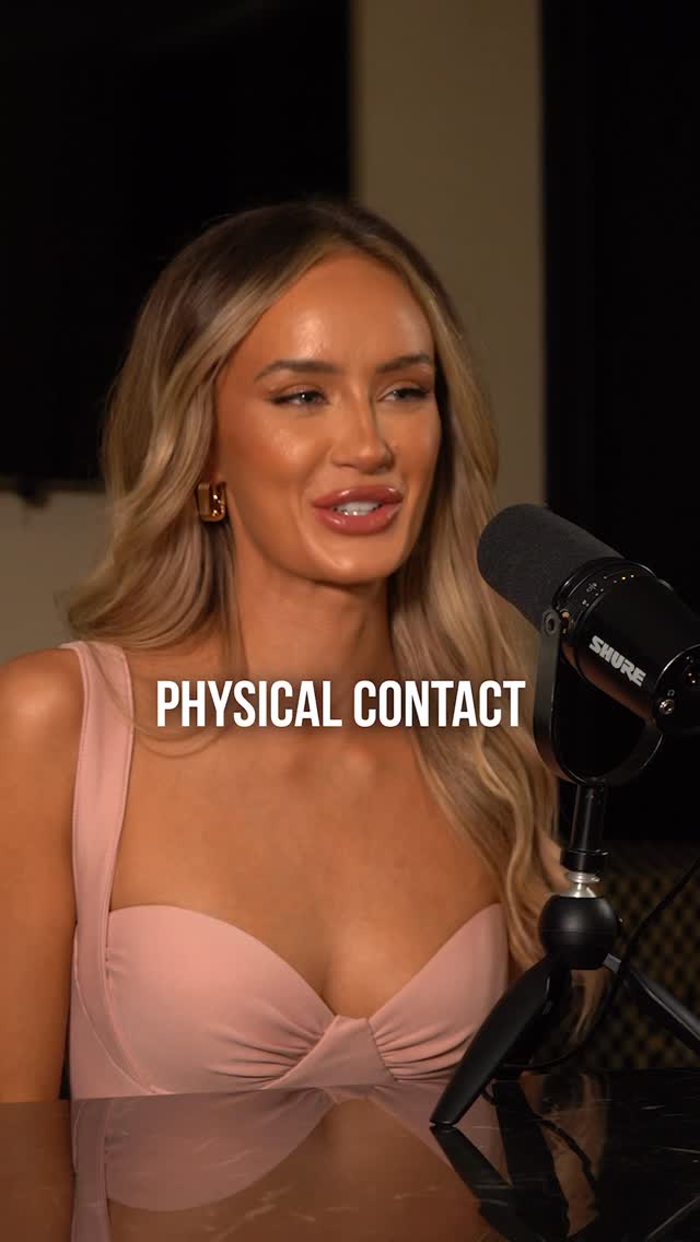 A medium shot features a smiling woman with long blonde hair, positioned behind a microphone. The background is dark, and a text overlay reads 'PHYSICAL CONTACT'.