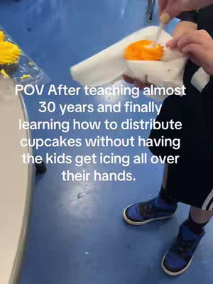 A person is preparing a cupcake. The scene is a point-of-view shot with text overlay.