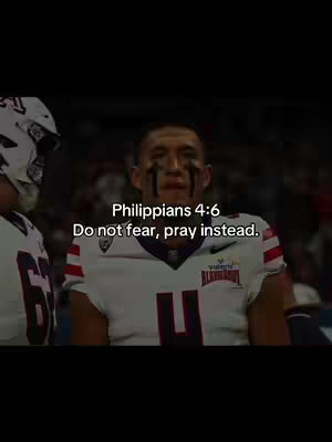 The image features a football player in a white jersey with red and black accents, standing on a football field. The player has black eye paint. Text overlays on image with Bible verse.
