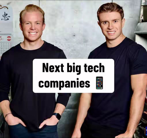 Two young men in black t-shirts are smiling and posing in front of a neutral background. A white rectangular overlay in the center of the image reads "Next big tech companies" in bold, black text, and has a smartphone icon next to it. The composition is simple, with good lighting and a focus on the subjects.