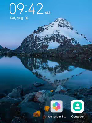 The cover image is a tranquil landscape depicting a snow-covered mountain reflected in a calm lake. The sky is a gradient of blue behind the mountain. The bottom of the image contains two app shortcuts along with some leaves