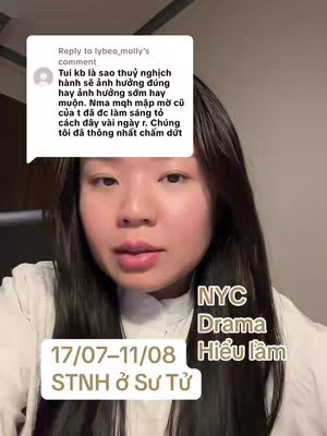 A woman with long dark hair and a simple top is centered in the frame of a selfie, with a comment overlaid at the top and text boxes on the bottom, against a blurred background.