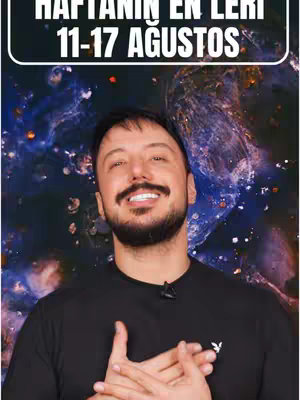 A man with a beard and a black t-shirt with a logo on it is smiling at the camera with a background that appears to be a starry galaxy. There is a white rectangle with black text in it that is over the top.