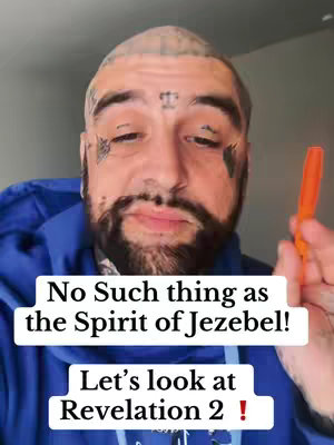 A close-up shot of a man with a shaved head, tattoos on his face and a thick beard. He is wearing a blue hoodie and holding an orange marker. Text overlays appear at the bottom of the image providing the hook.