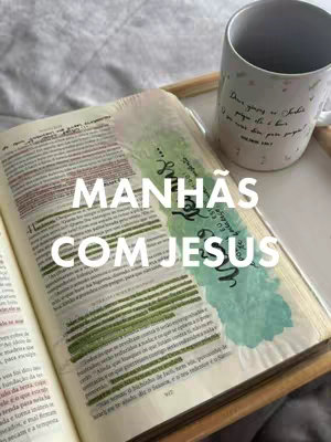 The image features an open Bible with highlighted passages, a cup of coffee, and a bookmark with handwritten text. The words "Manhãs com Jesus" (Mornings with Jesus) are overlaid in a bold, white font. The scene suggests a quiet, reflective morning routine.