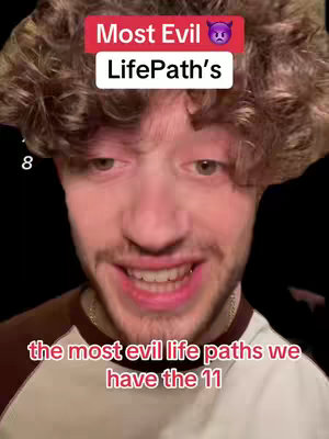 A close-up shot of a young man with curly brown hair, set against a dark background. He is smiling broadly, his expression suggesting enthusiasm or amusement. Above him is a red banner with the text 'Most Evil' and a devil emoji, and below him is text that reads 'the most evil life paths we have the 11'.