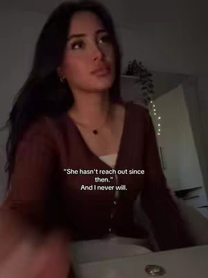 A young woman with long dark hair is the focus of the image, dressed in a dark red cardigan. Text overlay presents a personal message.