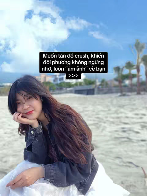 A young woman with long dark hair and a denim jacket sits on a sandy beach. She rests her chin on her hand, her gaze directed at the camera. The background shows a beach with a clear sky and some trees. A text overlay in a black box offers advice.