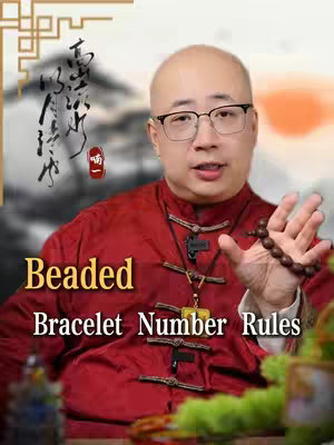 The cover image features a man in a red jacket holding a beaded bracelet, with text overlayed. A blurred background shows elements of traditional Chinese design, suggesting a cultural or spiritual theme. The man wears glasses and appears to be an expert or presenter. The background also has a sunset or light gradient. The text overlay is in yellow and white, providing a title or explanation related to beaded bracelets. The composition is focused and informative.
