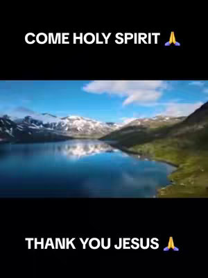 The image shows a scenic landscape featuring a lake surrounded by mountains with snow-capped peaks and a clear blue sky dotted with clouds. Text overlays at the top and bottom read 'COME HOLY SPIRIT' and 'THANK YOU JESUS' respectively.