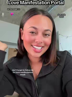 A woman smiles at the camera, likely from a selfie perspective. Text overlays state the video's theme: "Love Manifestation Portal" and include the date "June 25th 2025", along with additional text at the bottom and a "ULTRA RARE" tag. The background is a living space with a modern, clean aesthetic. The color palette is natural, with the woman's skin tone at the focal point.