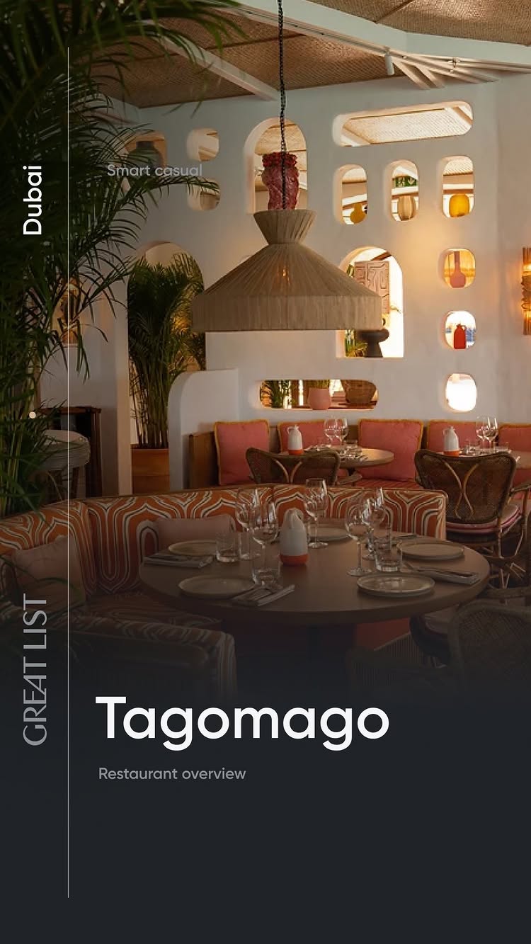 An interior shot of a stylish restaurant. The focus is on a round wooden table set with glasses and plates, surrounded by curved booth seating. The space features a combination of natural wood, white walls with arch-shaped cutouts, and warm lighting. The text 'GREAT LIST' is on the left in vertical format. Below, the restaurant's name, 'Tagomago', is prominently displayed, followed by 'Restaurant overview'.