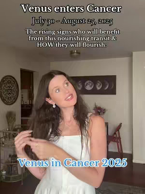 A woman with long brown hair stands in a well-lit room with cream walls. She wears a white top and smiles slightly. Text overlays at the top and bottom of the image present information. The background includes a decorative wall piece, a plant, and a glimpse of a wooden chair.