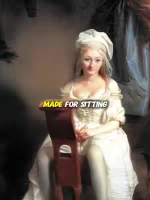 A woman in period clothing sits on a small wooden chair. She wears a white dress and a chef's hat. The background appears to be a blurred painting. Text overlaid on the image says 'MADE FOR SITTING' in a yellow and black font.