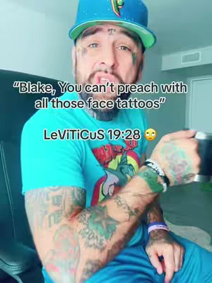 A man with numerous tattoos and a blue cap is holding a mug. Text overlayed on the image reads, "Blake, You can't preach with all those face tattoos" and references Leviticus 19:28.