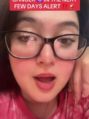 A close-up shot of a woman wearing thick-framed glasses and a pink tie dye shirt. The woman has fair skin and open mouth, she is looking directly at the camera. Red text overlay is at the top, partially cut off. Her right hand is touching her cheek. The lighting appears to be natural.