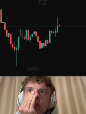 The cover image features a split view. Above, a stock chart displays green and red candlestick patterns against a black background. Below, a young man wearing a hoodie and headphones, is pressing his fingers to his nose and looking up with wide eyes, capturing an emotional reaction. The layout uses dark tones to highlight the financial data with a contrasting human reaction angle.