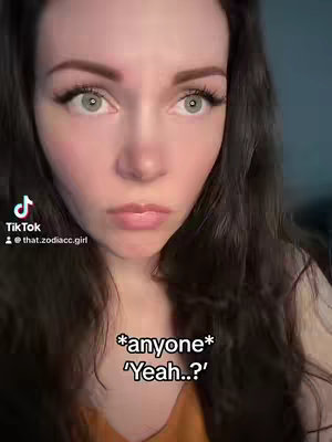A close-up shot of a woman with long, dark hair and light eyes. The woman has a neutral expression with her lips slightly pursed. Text overlays appear at the bottom, posing a question.
