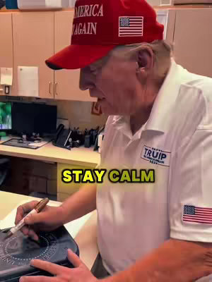 The cover image shows a man wearing a red cap with the words 'AMERICA' and 'AGAIN', white shirt, holding a pen and signing something. The background shows a workspace with some cabinets and computer screens.