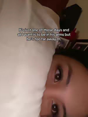 The cover image shows a close-up of a person's face lying on a pillow. The person has dark hair and brown eyes, with the majority of the image dominated by a white pillowcase in the lower left. Text is overlaid in the middle of the image, positioned above the person's eyes and towards the top center, creating a layout centered on the person's face. Lighting seems soft and natural.