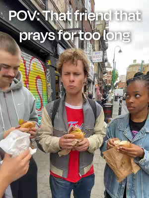 An outdoor shot features three individuals holding sandwiches, set against a backdrop of city buildings and storefronts. Overlaid text reads 'POV: That friend that prays for too long'. The focus is on a group of friends standing on a sidewalk, with varying facial expressions.