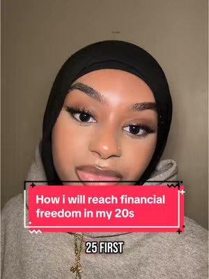 A selfie-style image featuring a woman with a black hijab and full makeup, including defined eyebrows, long eyelashes, and glossy lips. She is looking towards the camera with her tongue out. A red rectangular bar with white text "How I will reach financial freedom in my 20s" is placed near the bottom, with a smaller black rectangular bar below that says "25 FIRST". The background is a plain, light-colored wall.
