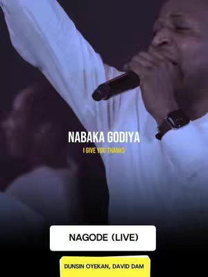 The cover image features a live performance with a man singing into a microphone, his right arm raised. Text overlays include the song title and artist information, set against a dark background with bright stage lighting.