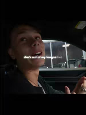 A man is sitting in a car, looking upward with an open mouth, conveying a surprised or awestruck expression. The text overlay suggests humor or a relationship-related theme. The overall composition is dark, the focus is on the man's face, and it looks like the shot was taken using a phone.