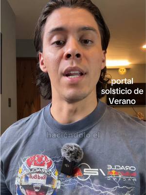 A man with dark hair appears in front of a light-colored wall. He wears a gray t-shirt, and a microphone is attached near his neck. Text overlays are present, with additional details in the background.
