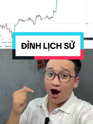 The cover image features a man with glasses looking surprised and pointing. A chart is in the background. The text overlay says "ĐỈNH LỊCH SỬ",.