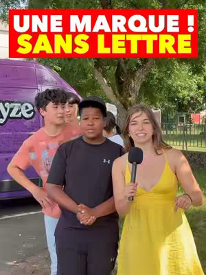 The video cover features a woman with a microphone, smiling and gesturing towards the camera. She is standing in front of three other people. A purple van is in the background, and a banner with text overlay is at the top.