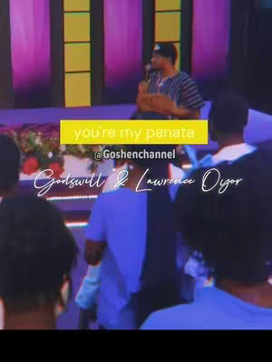 The cover image captures a live performance on stage during a Christian music event. The backdrop features tones of purple, and the central focus is on a man holding a microphone, presumably singing. Several people are in the foreground, observing the performance. Overlaid text includes the phrase "You're my panata" in a yellow bar, the name of a channel and the names “Godswill & Lawrence Oyor”. The overall composition is vibrant, conveying a sense of energy and spiritual engagement.