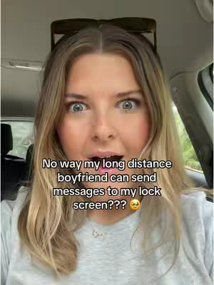 A young woman with blonde hair and wide eyes looks directly at the camera with an open mouth in a surprised expression. Text is overlaid, and she's positioned inside a car. Sunglasses are perched on her head.