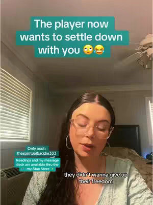 A woman with long dark hair and glasses is the primary focus. Text overlays are present, and the background is a room with a window and bed.