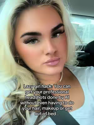 A close-up selfie of a woman with blonde hair and makeup. The image has text overlayed on the bottom that reads "Lazy girl hack: You can get your professional headshots done by AI without even having to do your hair, makeup or get out of bed..."