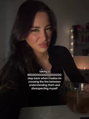 A woman with dark hair looks at the camera with a pained expression. Text is overlaid on the image.