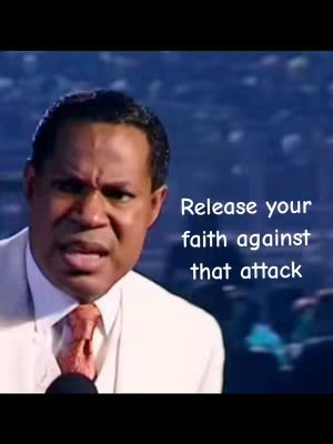 A man in a white suit with a deep orange tie speaks into a microphone. Text overlayed on the image reads, “Release your faith against that attack”. The background is blurred, appearing to be a large assembly.