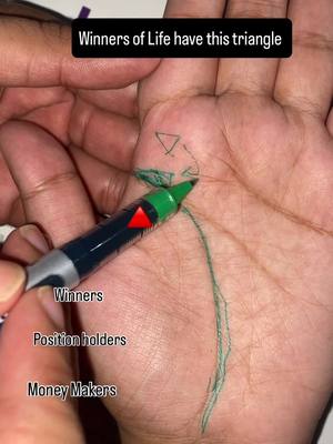 The image shows a close-up of a hand holding a green pen, with lines drawn on the palm. A green pen is shown pointing toward a palm, with a green line drawn. Another hand is shown in the top.  Text overlays are present, noting "Winners of Life have this triangle" at the top and other text at the bottom like "Winners", "Position holders", and "Money Makers".