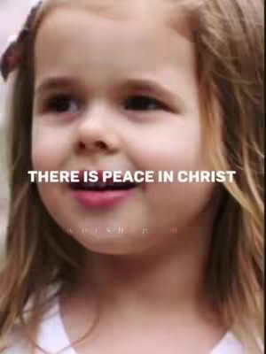 A close-up shot of a young girl with fair skin and blonde hair. She's looking slightly off-camera to the left with a gentle smile. The text overlay reads 'THERE IS PEACE IN CHRIST'.